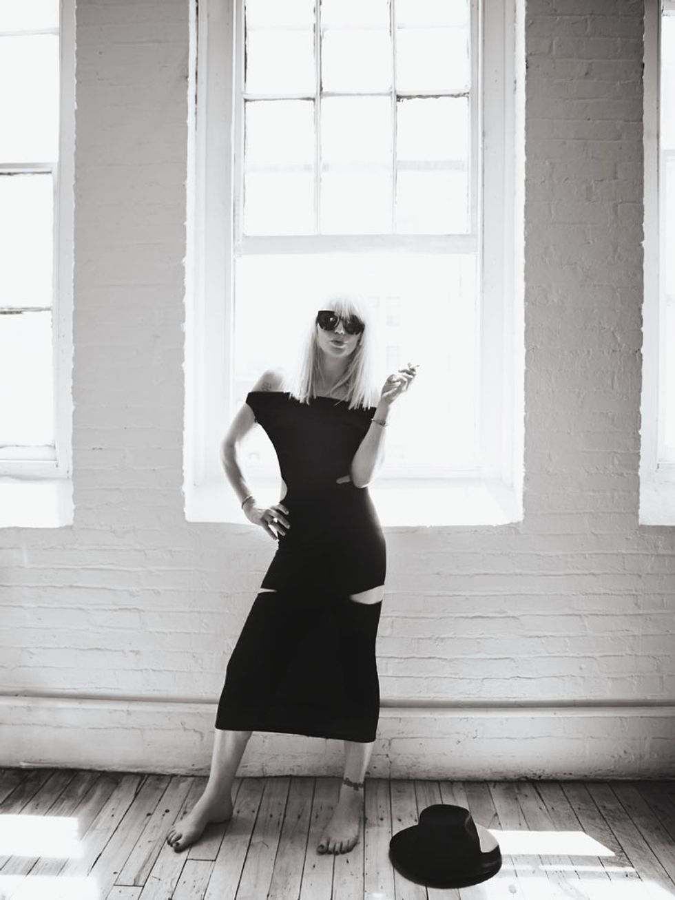 Courtney Love smoking with hat