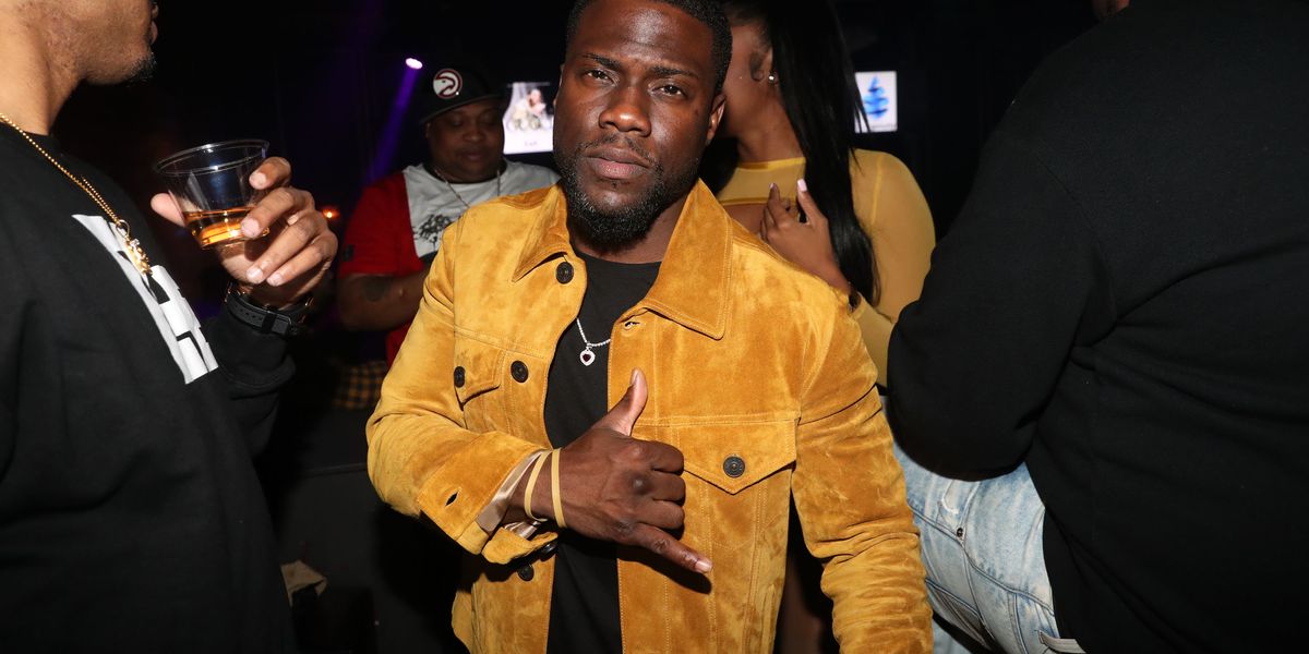 A Gold Kevin Hart Holds Pride Flag on Hollywood Boulevard