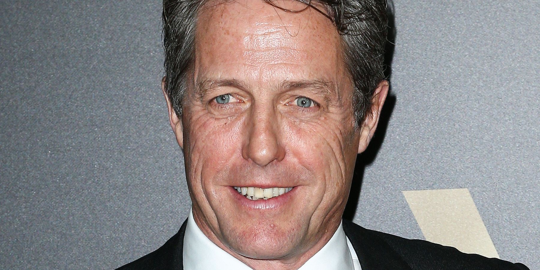 Hugh Grant Gives Ashley Graham an Awkward Oscars Interview