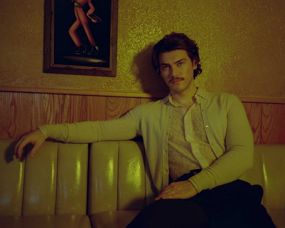 Jack Inannen standing near a window in a New York City Bar.