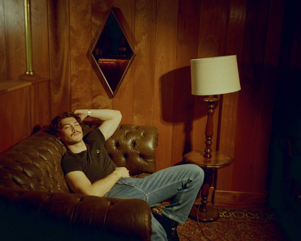 Jack Innanen in a black t-shirt and jeans.