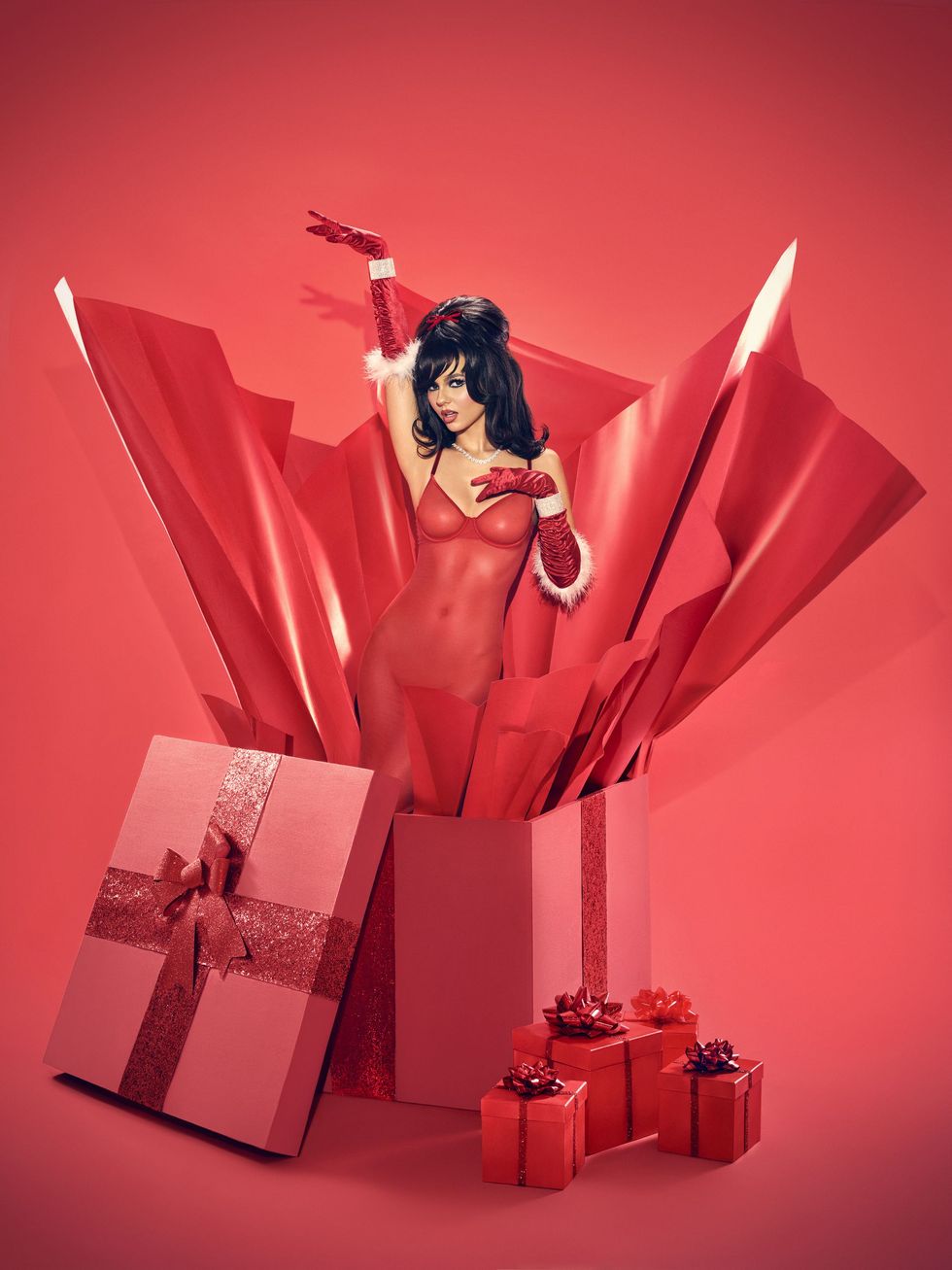 Victoria Justice pops out of a Christmas gift box ahead of her new single